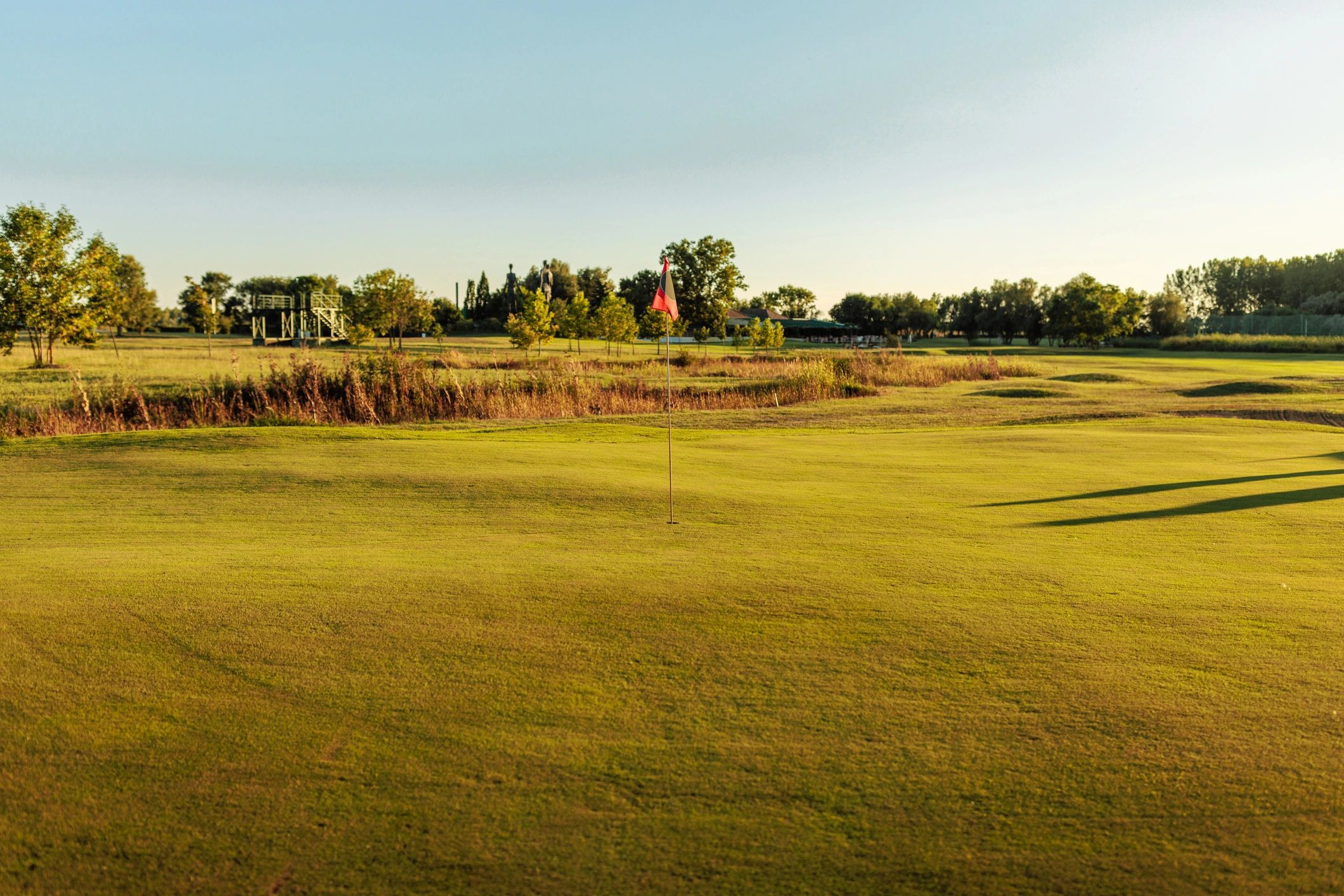 Wide shot of a luxury golf course on a sunny day