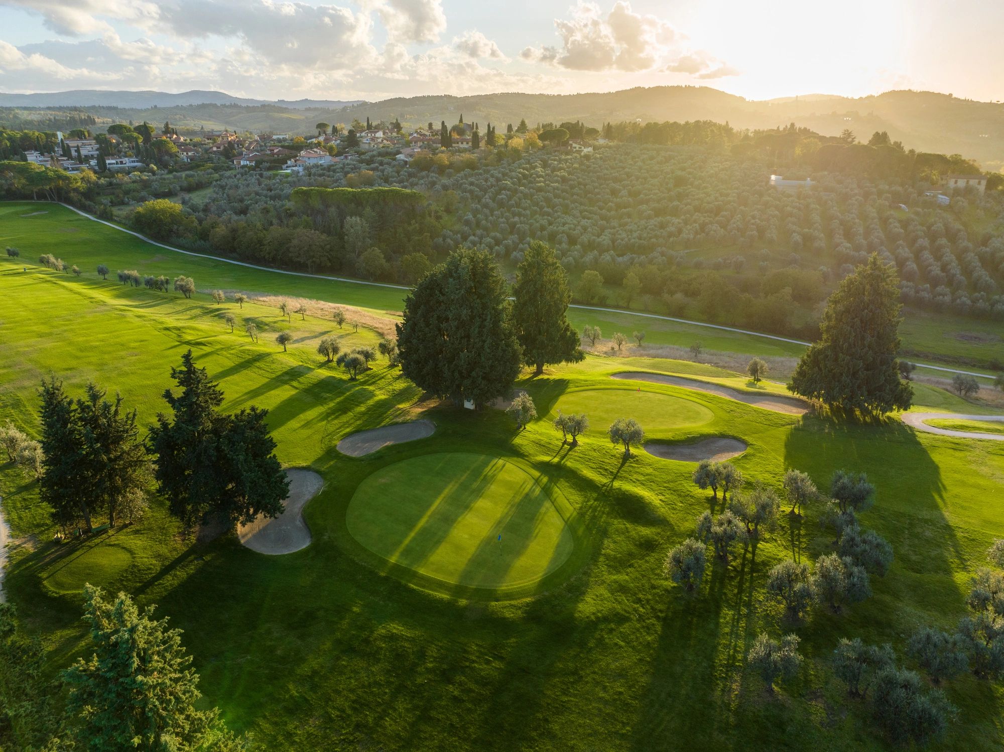 Aerial golf course view at golden hour